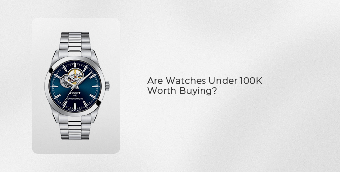 Tissot watch with a blue dial and stainless steel bracelet, illustrating whether watches under 100K are worth buying