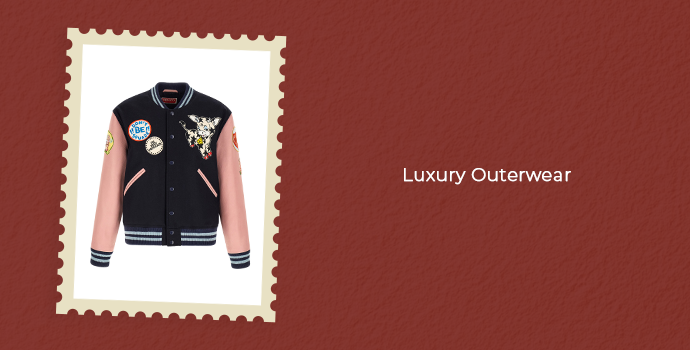 Luxury outerwear featuring a designer varsity jacket with embroidered patches